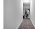Hallway leading to closet featuring carpet and storage capabilities at 2905 Glendale Rd, Kenly, NC 27542