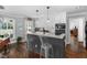 Modern kitchen featuring island with seating and updated appliances at 2905 Glendale Rd, Kenly, NC 27542