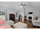 Bright living room featuring fireplace, hardwood floors, and vaulted ceiling at 2905 Glendale Rd, Kenly, NC 27542