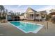 Backyard pool with a metal fence and a screened in porch at 2905 Glendale Rd, Kenly, NC 27542