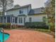 Backyard view features a pool, patio, and sunroom of this beautiful home at 2932 Candlehurst Ln, Raleigh, NC 27616