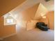 Upstairs bonus room with vaulted ceilings, a lounge area, and ample storage at 2932 Candlehurst Ln, Raleigh, NC 27616