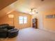 Spacious bonus room with unique ceiling, ceiling fan, and comfortable seating area at 2932 Candlehurst Ln, Raleigh, NC 27616