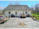 Large wooden backyard deck featuring patio furniture and outdoor seating at 30 Shannon Rd, Timberlake, NC 27583