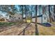 Spacious backyard featuring a large deck, storage shed, and mature trees at 30 Shannon Rd, Timberlake, NC 27583