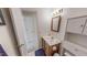 Cozy bathroom with wood vanity, framed mirror and tile flooring at 30 Shannon Rd, Timberlake, NC 27583