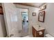 Bright bathroom with wooden vanity and access to a carpeted room at 30 Shannon Rd, Timberlake, NC 27583