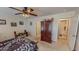 Bedroom featuring neutral walls, a ceiling fan, and an adjacent hallway at 30 Shannon Rd, Timberlake, NC 27583