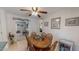 Cozy dining area adjacent to the kitchen with a ceiling fan and space for six at 30 Shannon Rd, Timberlake, NC 27583