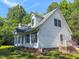 Charming two-story house with green shutters and landscaped yard at 30 Shannon Rd, Timberlake, NC 27583