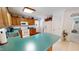 Functional kitchen features wood cabinets, white appliances, and solid surface countertops at 30 Shannon Rd, Timberlake, NC 27583