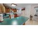 Well-equipped kitchen with wood cabinetry, white appliances, and solid surface countertops at 30 Shannon Rd, Timberlake, NC 27583
