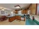 Spacious kitchen with light wood cabinets and an adjacent dining area with a wood table at 30 Shannon Rd, Timberlake, NC 27583