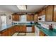 Traditional kitchen with light wood cabinets, white appliances, and light-green countertops at 30 Shannon Rd, Timberlake, NC 27583
