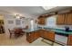 Open-concept kitchen featuring a breakfast bar, wood cabinets, and adjacent dining area at 30 Shannon Rd, Timberlake, NC 27583
