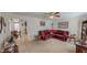 Cozy living room with plush sectional sofa, neutral carpet, and doorway to the kitchen at 30 Shannon Rd, Timberlake, NC 27583