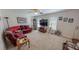 Cozy living room with carpeted floors, a comfortable couch, and ample natural light at 30 Shannon Rd, Timberlake, NC 27583