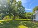 Spacious yard with a mature tree that provides plenty of shade at 30 Shannon Rd, Timberlake, NC 27583