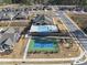 Aerial view showcases the neighborhood amenities including the community pool and tennis courts at 301 Crayton Oak Dr, Cary, NC 27519