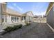 Spacious backyard featuring a screened-in porch with a patio, landscaping, and a partial fence at 301 Crayton Oak Dr, Cary, NC 27519