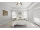 Airy bedroom with a tray ceiling, modern decor, and plenty of natural light at 301 Crayton Oak Dr, Cary, NC 27519