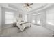 Bright bedroom with a tray ceiling, neutral decor, and access to a private balcony at 301 Crayton Oak Dr, Cary, NC 27519