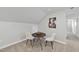 Bonus room seating area with round table, chairs, carpet and natural lighting at 301 Crayton Oak Dr, Cary, NC 27519