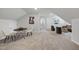 Spacious bonus room featuring neutral walls, carpet, a seating area and a game table at 301 Crayton Oak Dr, Cary, NC 27519