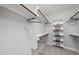 Organized walk-in closet with built-in shelving and ample storage space for clothing and accessories at 301 Crayton Oak Dr, Cary, NC 27519