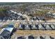 Aerial view of a residential community with a swimming pool, tennis court, and manicured lawns at 301 Crayton Oak Dr, Cary, NC 27519