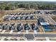 Aerial view of a community with manicured lawns, sidewalks, pool, and tennis courts at 301 Crayton Oak Dr, Cary, NC 27519