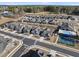 Aerial view of a neighborhood featuring a pool, tennis court, sidewalks, and well-maintained landscaping at 301 Crayton Oak Dr, Cary, NC 27519