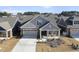 Charming single-Gathering home with a covered porch, two-car garage, well-manicured lawn, and neutral color palette at 301 Crayton Oak Dr, Cary, NC 27519