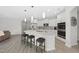 Bright kitchen with a large island, stainless steel appliances, and eat-in breakfast bar at 301 Crayton Oak Dr, Cary, NC 27519