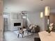 Comfortable living room with fireplace, contemporary decor, ceiling fan and modern accents at 301 Crayton Oak Dr, Cary, NC 27519