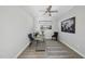 Well-lit office space with gray wood flooring, modern decor, and a stylish ceiling fan at 301 Crayton Oak Dr, Cary, NC 27519
