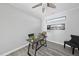 Bright home office featuring grey wood floors, ceiling fan, and modern decorations at 301 Crayton Oak Dr, Cary, NC 27519