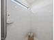 Luxurious tiled shower with marble tiling, a small window, and built in shelving at 301 Crayton Oak Dr, Cary, NC 27519