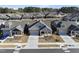 Street view of a gray single-Gathering home featuring a covered porch, two-car garage, and landscaped yard at 301 Crayton Oak Dr, Cary, NC 27519