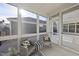 Bright sunroom featuring neutral decor, comfortable seating and plenty of natural light at 301 Crayton Oak Dr, Cary, NC 27519