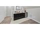 A stylish wet bar area featuring dark cabinetry, white countertops, a mini fridge and popcorn machine at 301 Crayton Oak Dr, Cary, NC 27519