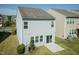 Backyard with patio, landscaping, green grass, and grey siding at 3011 September Dr, Durham, NC 27703