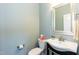 Stylish half bathroom with modern fixtures, vanity and toilet at 3011 September Dr, Durham, NC 27703