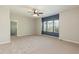 Inviting bedroom with walk-in closet, carpet flooring, ceiling fan, and large windows at 3011 September Dr, Durham, NC 27703