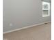 This bedroom has light grey walls, carpet, and a window at 3011 September Dr, Durham, NC 27703