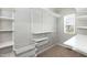 Organized walk-in closet with shelving, racks, and a window at 3011 September Dr, Durham, NC 27703