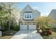 Charming two-story home featuring a stone and siding exterior with a two-car garage at 3011 September Dr, Durham, NC 27703