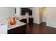Bright kitchen showcasing dark cabinets, granite countertops, and stainless steel sink at 3011 September Dr, Durham, NC 27703