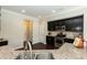 Modern kitchen features stainless steel appliances, granite countertops, and dark cabinets at 3011 September Dr, Durham, NC 27703