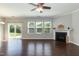 Spacious living room boasts hardwood floors, a fireplace, large windows, and a sliding glass door at 3011 September Dr, Durham, NC 27703